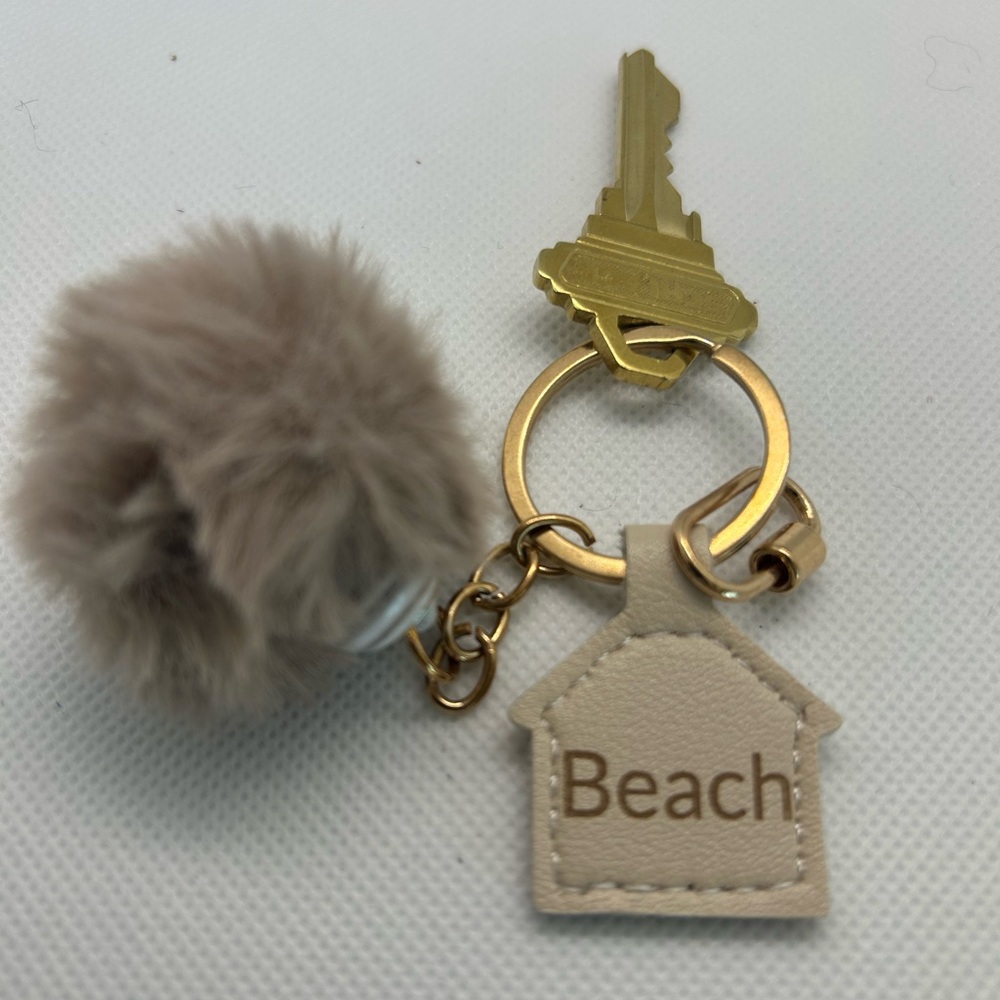Beige Pom Pom Keychain with Gold Accents